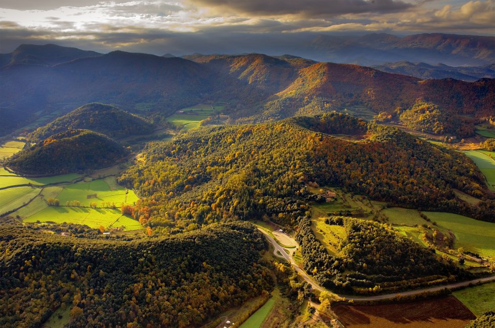 The La Garrotxa Volcanic Zone Natural Park features almost 40 different volcanoes. Despite the landscape being formed by volcanic activity, the areaâs rainy climate has resulted in the long dormant volcanoes being covered in vegetation.